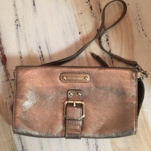 Bronze wristlet with strap and credit card slots